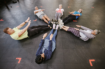 Image showing Gym, fitness workout and group doing exercise for abdomen together in a health training class. Studio floor, stretching and sport of athlete group and friends with cardio, target goals and challenge