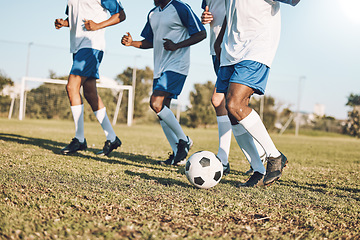 Image showing Sports, soccer and team playing on the field at a game competition, league or championship. Fitness, football and male sport players running with a ball at an outdoor match on the soccer field.