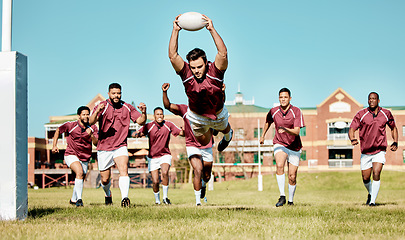 Image showing Rugby, athlete on field and sports game with men, team running and player score a try with ball, fitness and active outdoor. Exercise, championship match and teamwork with cheers, action and energy