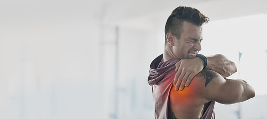 Image showing Man, training and shoulder pain with mockup space at gym for workout, exercise and muscle injury. Bodybuilder, anatomy emergency or problem by mock up, wall background or medical accident with hands