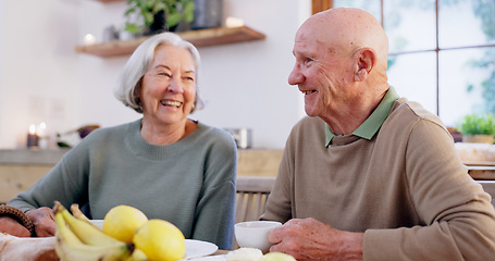 Image showing Laughing, retirement and a senior couple drinking tea in the dining room of their home together in the morning. Smile, funny or conversation with an elderly man and woman in an apartment for romance