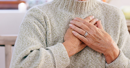 Image showing Hands, breathing and heart attack with an elderly person in the dining room of a retirement home closeup. Healthcare, medical or emergency and a senior adult with chest pain for cardiac arrest