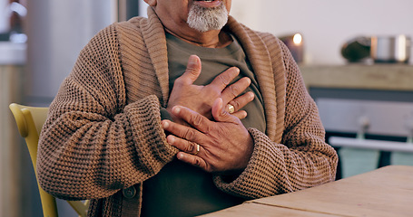 Image showing Hands, breathing and heart attack with a senior person in the dining room of a retirement home closeup. Healthcare, medical or emergency and an elderly adult with chest pain for cardiac arrest