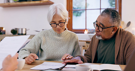Image showing Couple, paperwork and reading for insurance in retirement, planning and bills or documents. Senior people, marriage and communication or discussion for future, saving and finance in kitchen at home