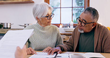 Image showing Couple, documents and reading for insurance in retirement, planning and bills or paperwork. Senior people, marriage and communication or discussion for future, saving and finance in kitchen at home
