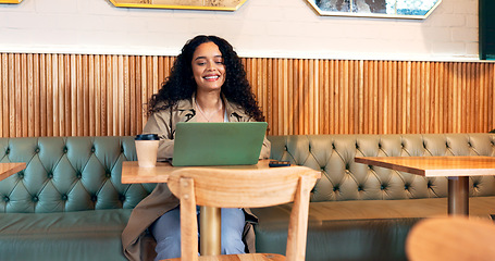 Image showing Happy woman in cafe, typing on laptop and remote work, reading email or writing blog, article or search on technology. Computer, freelancer or copywriting in coffee shop, store or restaurant at table