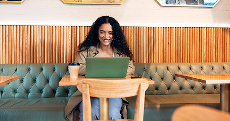 Image showing Happy woman in coffee shop, typing on laptop and remote work, reading email or writing blog, article or search on technology. Computer, freelancer or copywriting in cafe, store or restaurant at table