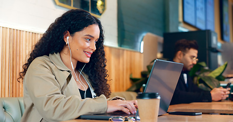 Image showing Woman, typing and laptop in coffee shop for remote work, research or networking for business with smile. Face, person and happiness with music in restaurant for copywriting, internet and freelancer