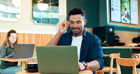 Image showing Man, reading glasses and laptop at cafe for online research, remote work and review of blog or social media. Happy freelancer worker in coffee shop or restaurant with computer for menu or information