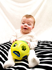 Image showing Cute little baby boy playing with toy