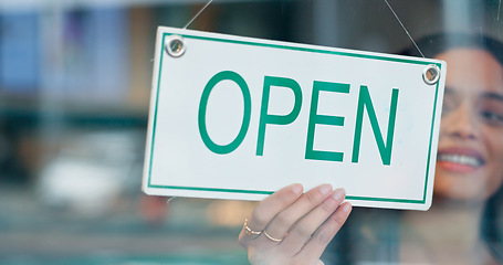 Image showing Happy woman, small business or open sign on window in coffee shop or restaurant ready for service. Advertising, start or entrepreneur holding board, poster or welcome for message in diner or cafe