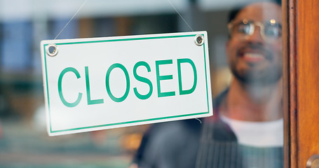 Image showing Happy man, small business or closed sign on window in coffee shop or restaurant for end of service. Closing time, smile or manager with board, poster or message in retail store or cafe for notice