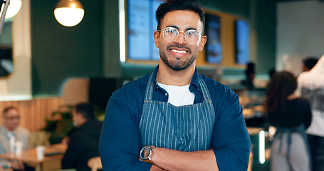 Image showing Waiter, man and portrait with arms crossed or smile for service, welcome or server in coffee shop. Barista, person and face with happiness for hospitality, career or confidence in restaurant or cafe