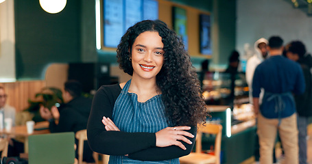 Image showing Waitress, woman and portrait with arms crossed or happy for service, welcome or server in coffee shop. Barista, person and face with smile for hospitality, career or confidence in restaurant or cafe