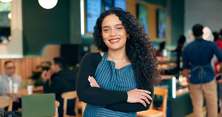 Image showing Waitress, woman or portrait with arms crossed or smile for service, welcome or server in coffee shop. Barista, person or face and happiness for hospitality, career or confidence in restaurant or cafe