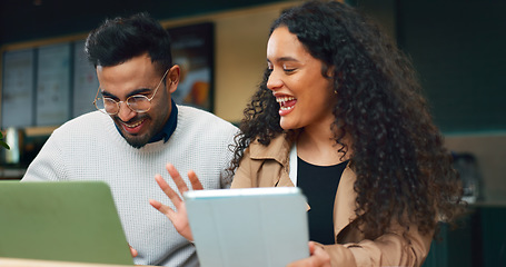 Image showing Coworkers, laptop and remote work with tablet, cafe and technology for business, strategy and planning. Conversation, meeting and brainstorming for project, woman and man in partnership, happy or job