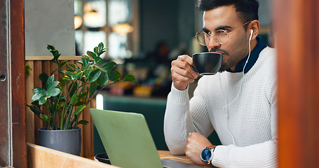 Image showing Man, remote work and cafe with laptop, earphones and drink with reading, data analysis or thinking. Journalist, freelancer and ideas with computer, coffee shop and process for story, news or research