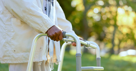 Image showing Hands, walking frame and a senior person in a garden outdoor in summer closeup during retirement. Wellness, rehabilitation or recovery and an elderly adult with a disability in the park for peace