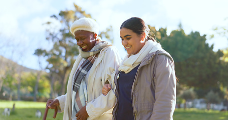 Image showing Senior care, old woman with cane and nurse in park with support, help or trust at nursing home. Retirement healthcare, elderly person and happy caregiver walk and talk in garden together with smile.