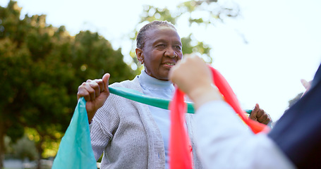 Image showing Senior woman, stretching band or nurse outdoor for exercise, workout or fitness in a park and happiness. People, professional or caregiver with physical activity for physiotherapy, wellness or health