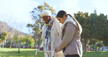 Image showing Senior care, old woman with walker and nurse in park with support, help or trust at nursing home. Retirement healthcare, elderly person and happy caregiver walk and talk in garden together with smile