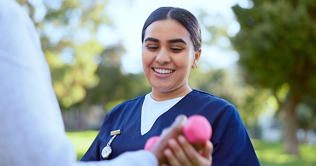 Image showing Hands, caregiver and dumbbell in support for exercise, workout or fitness in a park with happiness. People, professional or nurse with weightlifting for physiotherapy, wellness and health outdoor