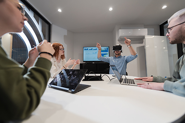 Image showing A diverse group of businessmen collaborates and tests a new virtual reality technology, wearing virtual glasses, showcasing innovation and creativity in their futuristic workspace