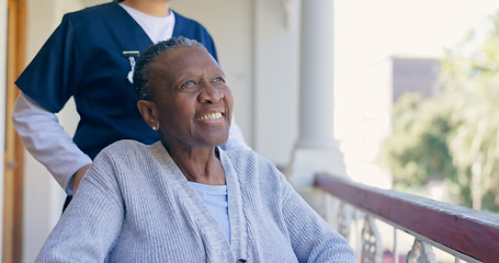 Image showing Old woman, wheelchair and nurse outdoor for smile in nature, balcony or elderly wellness. Medical caregiver, black patient and support for person with a disability or retirement home, air or sunlight