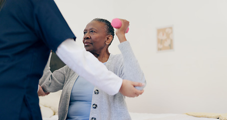 Image showing Caregiver, elderly woman or dumbbell in bedroom to help, exercise or workout in physiotherapy. Nurse, black person or senior care in physical therapy on bed, wellness support or healthcare service