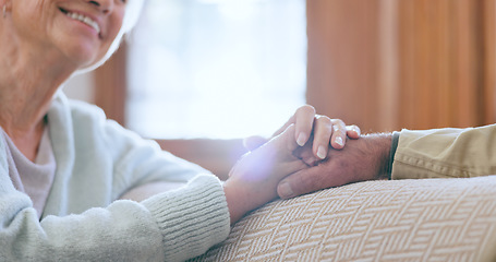 Image showing Support, love and senior couple holding hands in conversation in the living room at home. Discussion, affection and closeup of elderly man and woman in retirement with comfort in lounge at house.