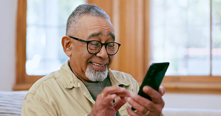 Image showing Phone, smile and social media with a senior man on a sofa in the living room of his home for retirement. Relax, app and a happy elderly person in an apartment for communication on his mobile