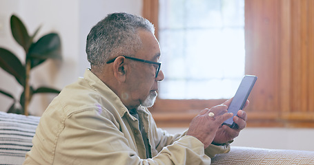 Image showing Relax, home and senior man with a smartphone, internet and connection with social media in a lounge. Mature person, elderly guy and pensioner with a cellphone, digital app and communication with text
