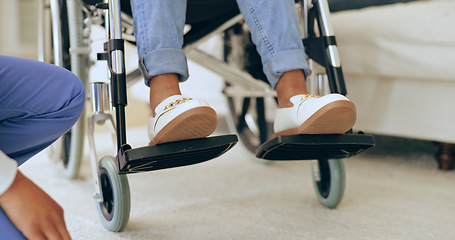 Image showing Feet, wheelchair and nurse with help in home for recovery, assessment and check progress for healthcare. Physiotherapist, doctor or caregiver for person with disability in house for rehabilitation