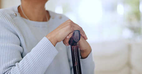 Image showing Hands, walking stick and closeup for woman in home with injury, recovery and wellness for mobility. Person with disability, cane and rehabilitation from accident for healthcare, progress and steps