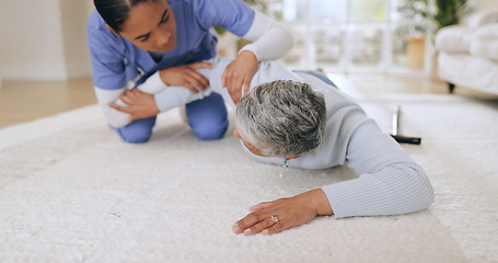 Image showing Fall, accident and senior patient with helping in a hospital with injury and caregiver support. Elderly care, emergency and floor with a person in pain with healthcare professional assistance