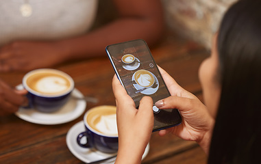 Image showing Photo, coffee and woman with a phone at a coffee shop for social media, internet and mobile app. Breakfast, latte and girl with a picture on mobile of drink at a cafe for photography and digital blog