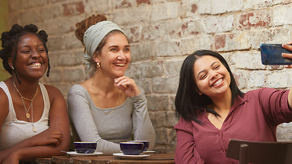 Image showing Selfie, coffee and friends at a cafe for a reunion, happy and being funny together. Coffee shop, comic and diversity with women and a photo on a phone for social media, live streaming or mobile app