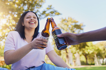 Image showing Happy friends, beer and toast in celebration at the park for holiday, summer and freedom to travel together. Smile of people cheers with alcohol in picnic, vacation and relax by in garden in summer