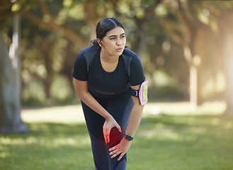 Image showing Knee pain, legs and emergency of sports woman, runner and athlete training in park for body workout, running and exercise. Female fitness, leg joint pain and problem in red glow of muscle injury risk