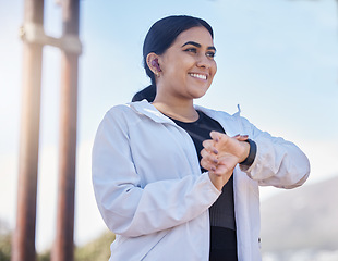 Image showing Woman, fitness and smartwatch, smile and happy with exercise, running time and heart rate outdoor. Young female with motivation, healthy and happiness with workout, runner or cardio goal and target