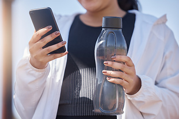 Image showing Exercise, phone and water for woman using fitness app to check progress, steps and health while outdoor for workout, running and training. Athlete runner with bottle and smartphone for social network