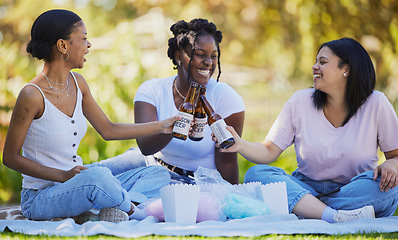 Image showing Black women, picnic and beer toast in park, nature environment or sustainability garden with food, popcorn or cotton candy. Smile, happy friends or bonding students with alcohol in celebration social