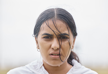 Image showing Rain, fitness and face portrait of woman in training resting on a cardio workout break outdoors in nature. Runner, winter and healthy Indian girl sweating in raining weather after sports exercise