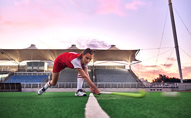 Image showing Sports, hockey and woman in stadium training for game, match or competition. Fitness, healthcare and hockey player outdoors on grass field practicing, exercise or workout with ball and hockey stick.