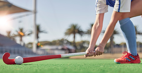 Image showing Hockey, sports and woman athlete on a turf field with a stick and ball for exercise, training and competition performance to win. Hands of hockey player on grass for sport goal, fitness and health