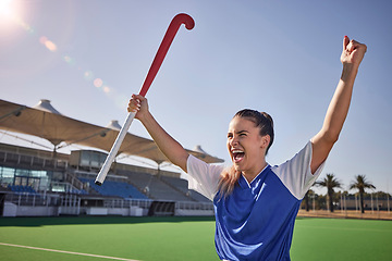 Image showing Hockey, winner and athlete woman in celebration after winning or scoring a goal at sports match or game on field. Fitness, win and young champion player happy about performance achievement in sport