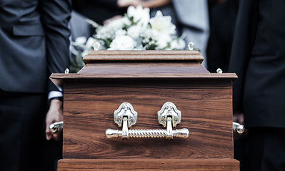 Image showing Coffin, people and funeral with death, grief and service with family carry casket to grave outdoor. Rip, farewell and ceremony or event for dead person together in respect, religion and spiritual