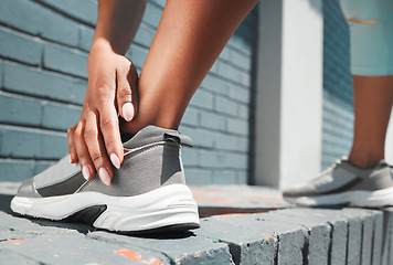 Image showing Woman, hand and shoes in fitness stretching for sports exercise, training or warm up for urban workout. Female hands on shoe for stretch, run or motivation for comfortable footwear for healthy cardio