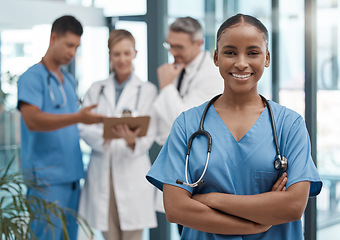 Image showing Doctor, portrait or black woman nurse with vision, motivation or leadership in hospital with team. Happy medical healthcare, wellness worker with smile at work for insurance or medicine in clinic