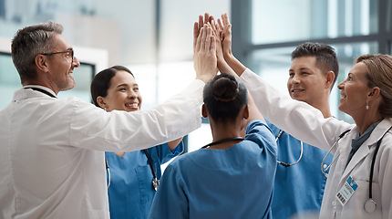 Image showing Hands, high five and collaboration with a team of a doctor, nurse and health professional working in the hospital. Teamwork, motivation and support with a medical group at work in a clinic for care